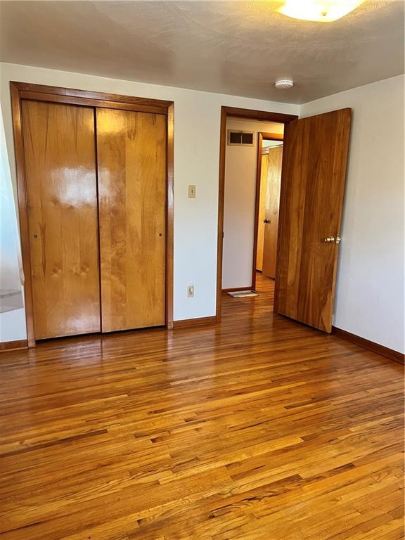 880 Pizza Barn Road Blairsville, PA 15717 - Photo 32 of 44 a view of an empty room with wooden floor and a window