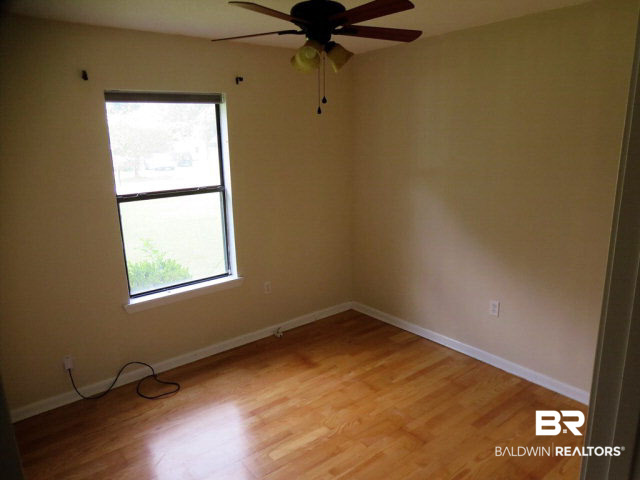 204 West Sycamore Avenue Foley, AL 36535 - Photo 4 of 11 Bedrooms have nice floors and ceiling fans. No carpet in house!