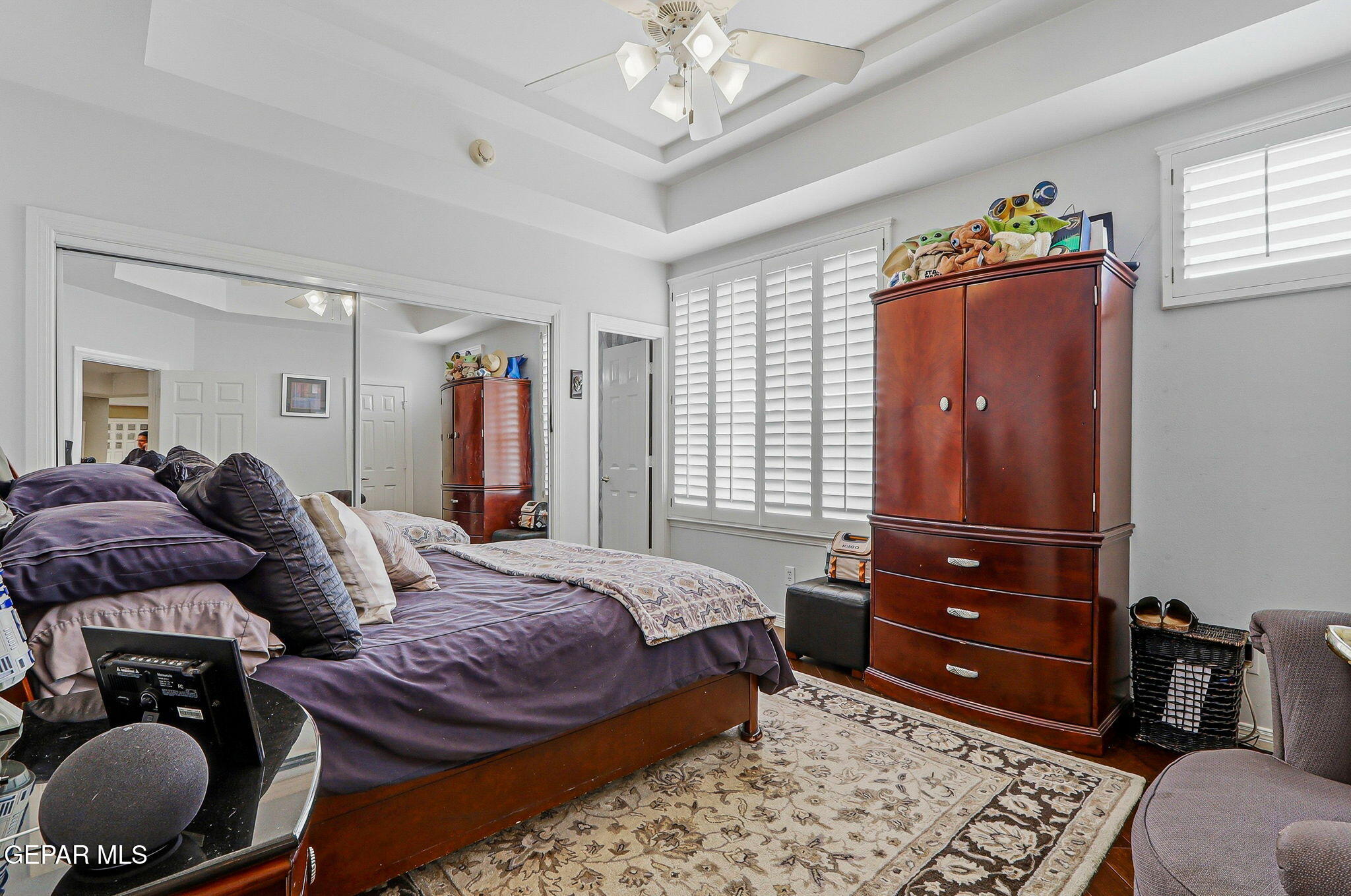 5806 Diamond Point Circle El Paso, TX 79912 - Photo 38 of 61 a bedroom with a bed and wooden floor