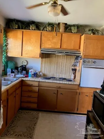 a kitchen with sink and window