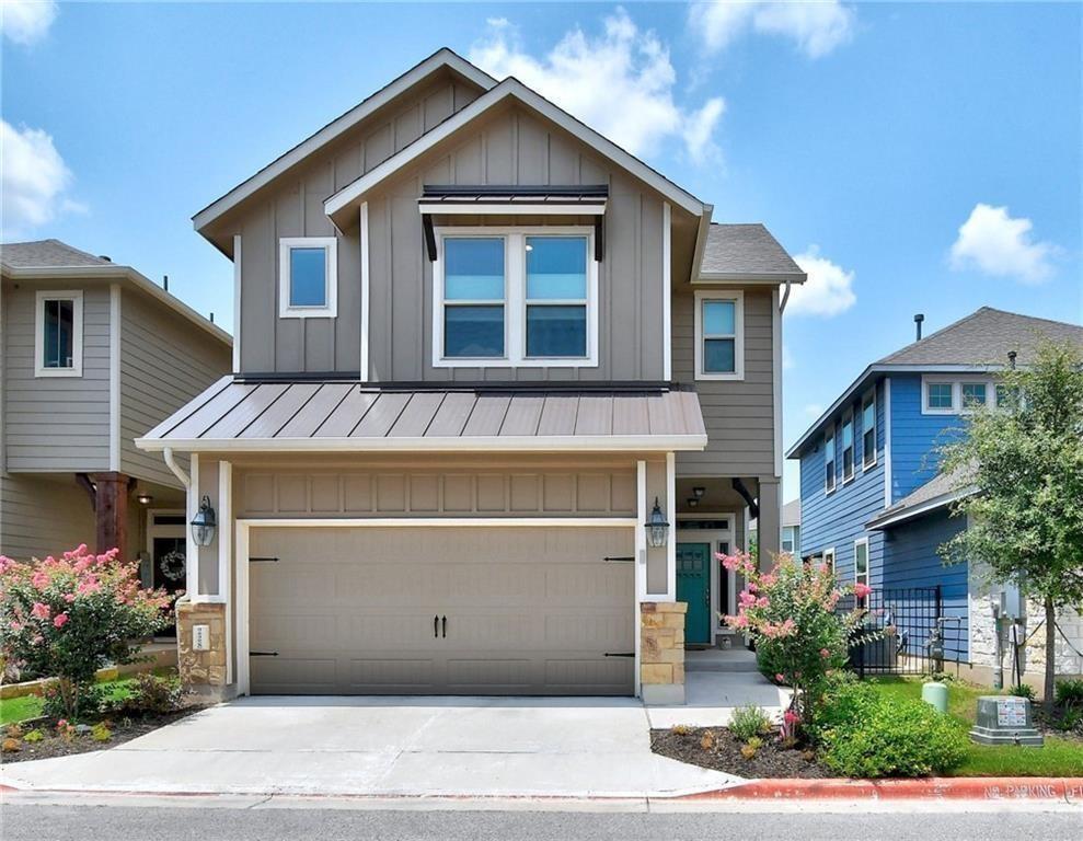 a front view of a house with a garage