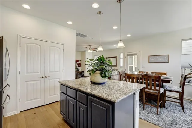 a kitchen with a table and chairs in it