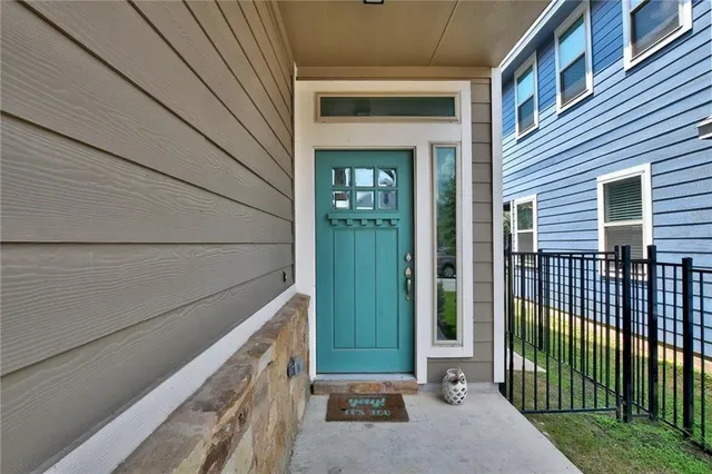 a view of a house with a small yard