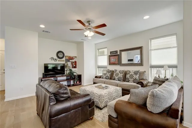 a living room with furniture and a window