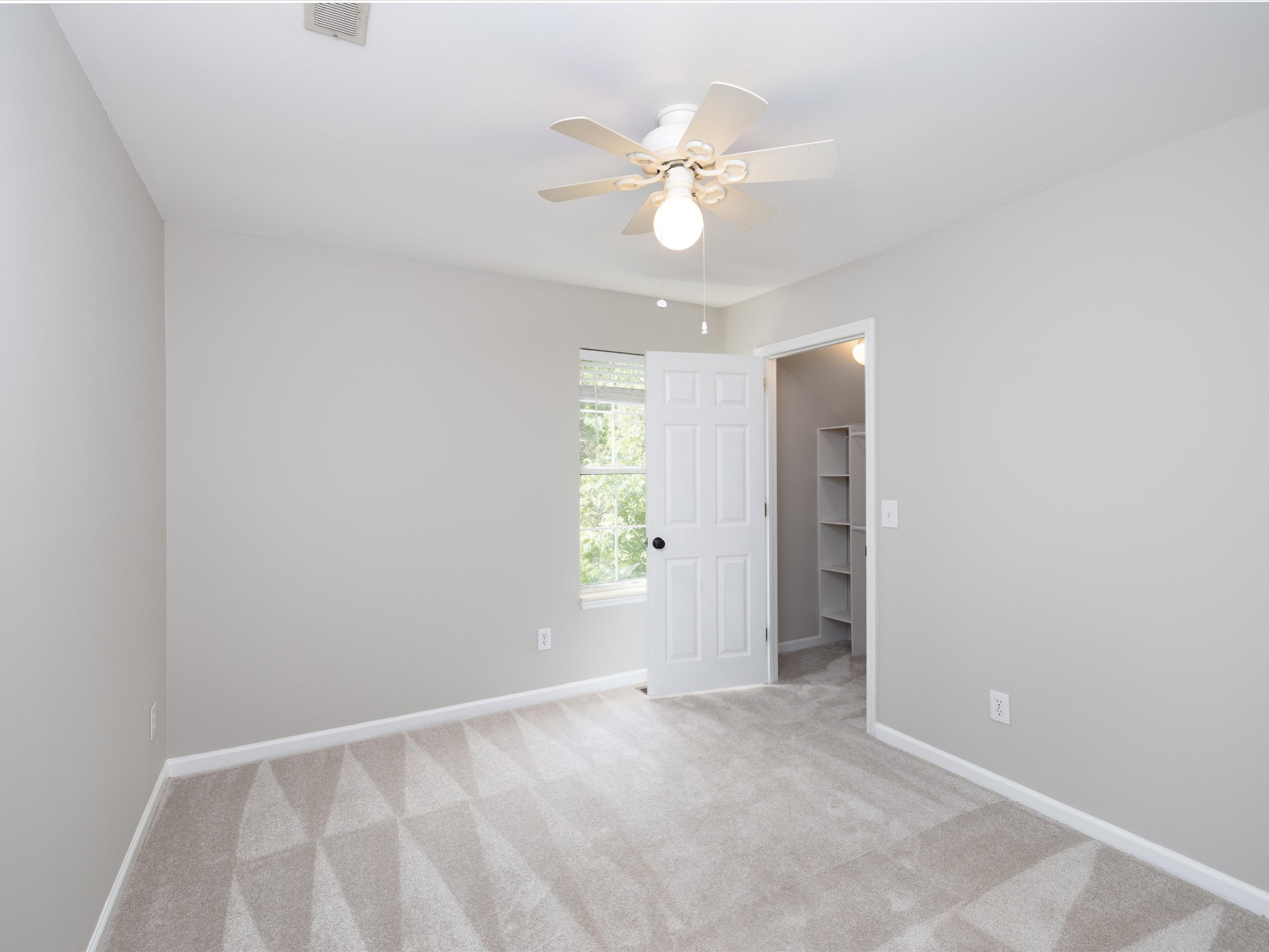 4629 Sandy Creek Road Nashville, TN 37221 - Photo 22 of 48 an empty room with closet and a chandelier fan