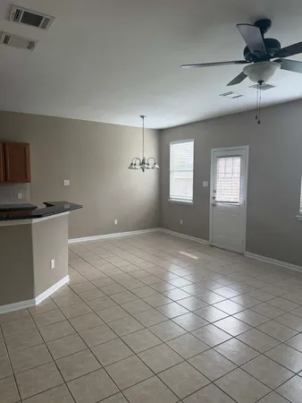 a view of a kitchen with a sink and a window