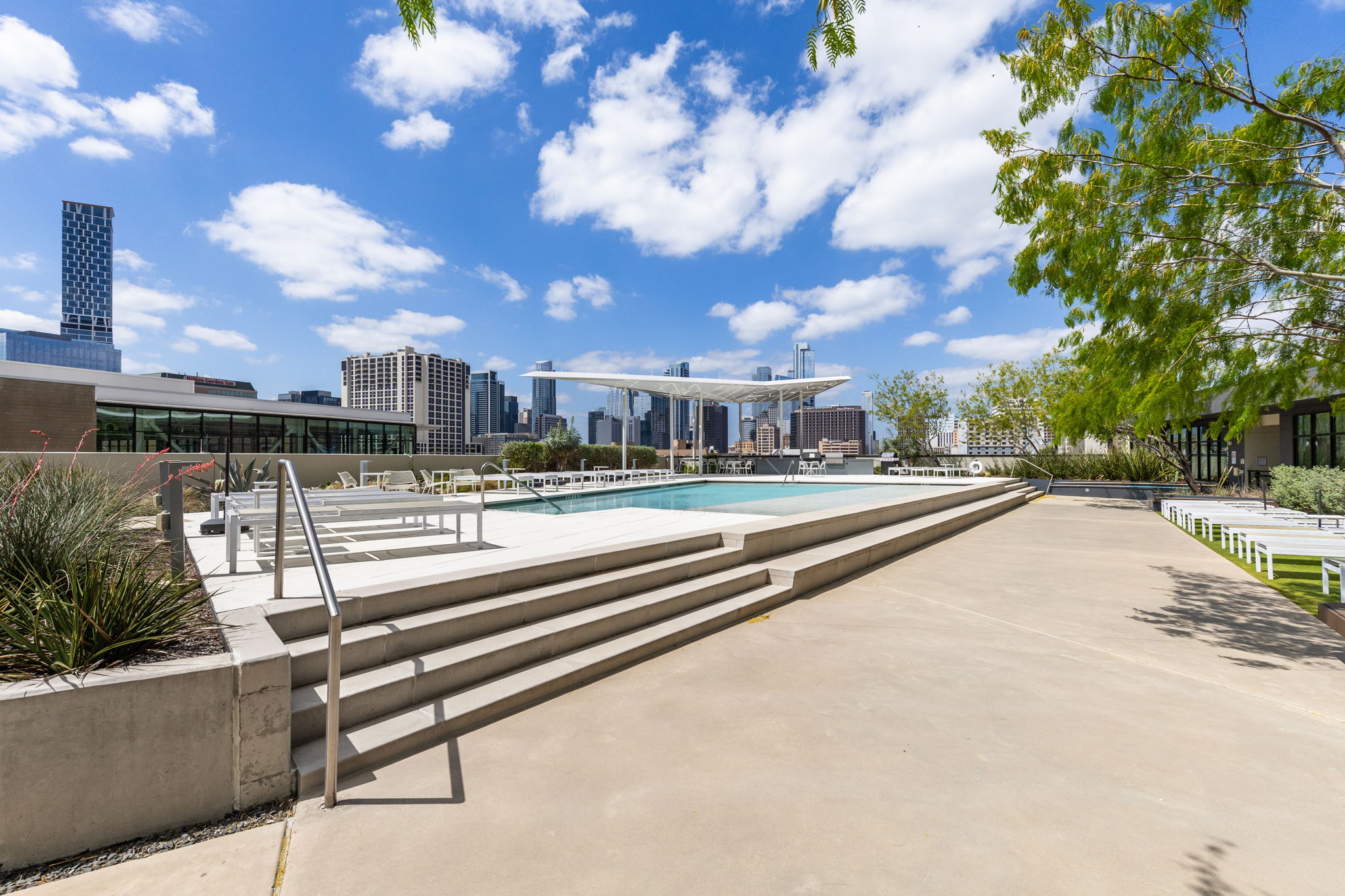 800 Embassy Drive, Unit 113 Austin, TX 78702 - Photo 22 of 36 Community pool with a patio and a city view