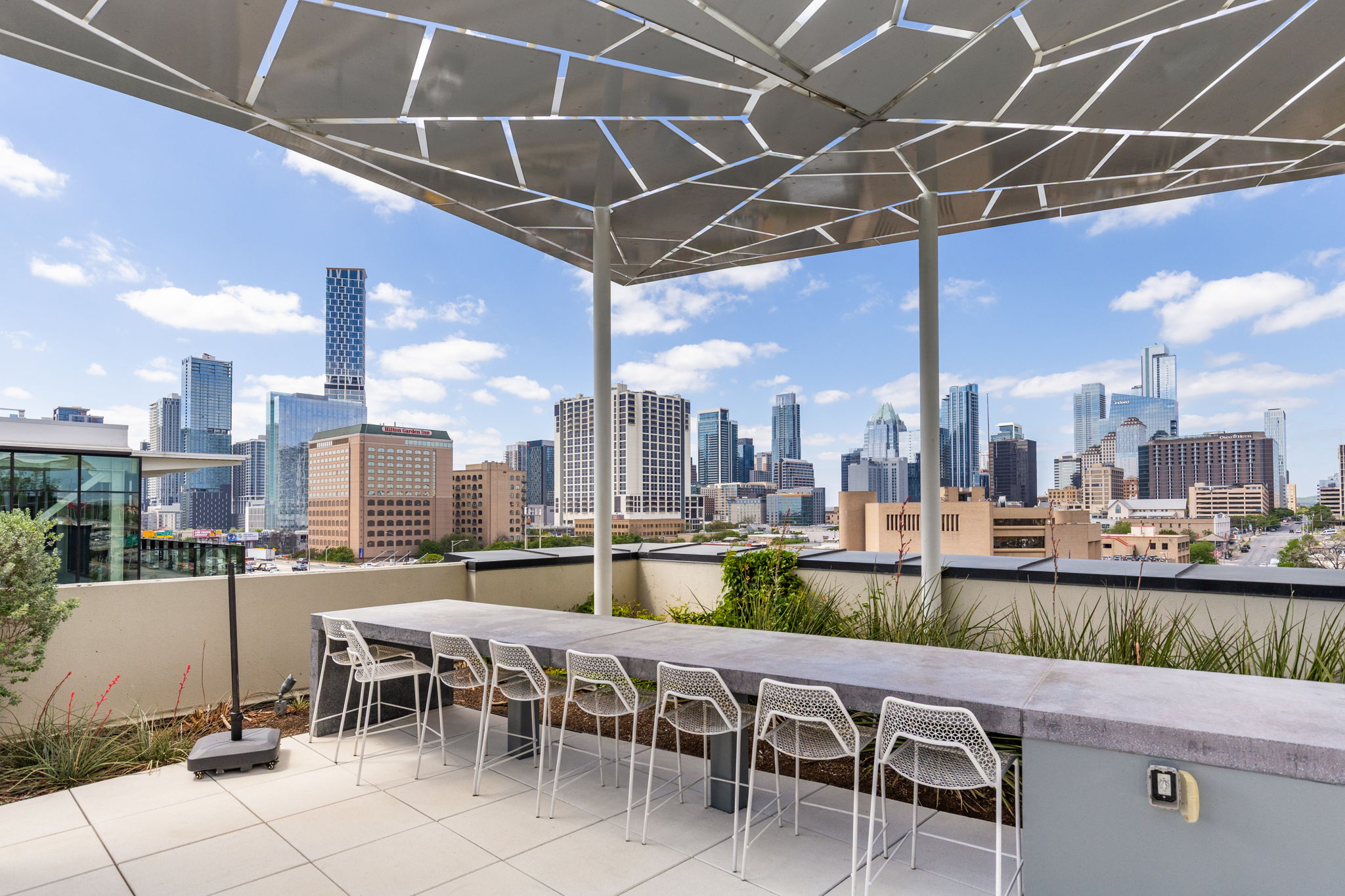 800 Embassy Drive, Unit 113 Austin, TX 78702 - Photo 25 of 36 View of patio featuring a skyline view