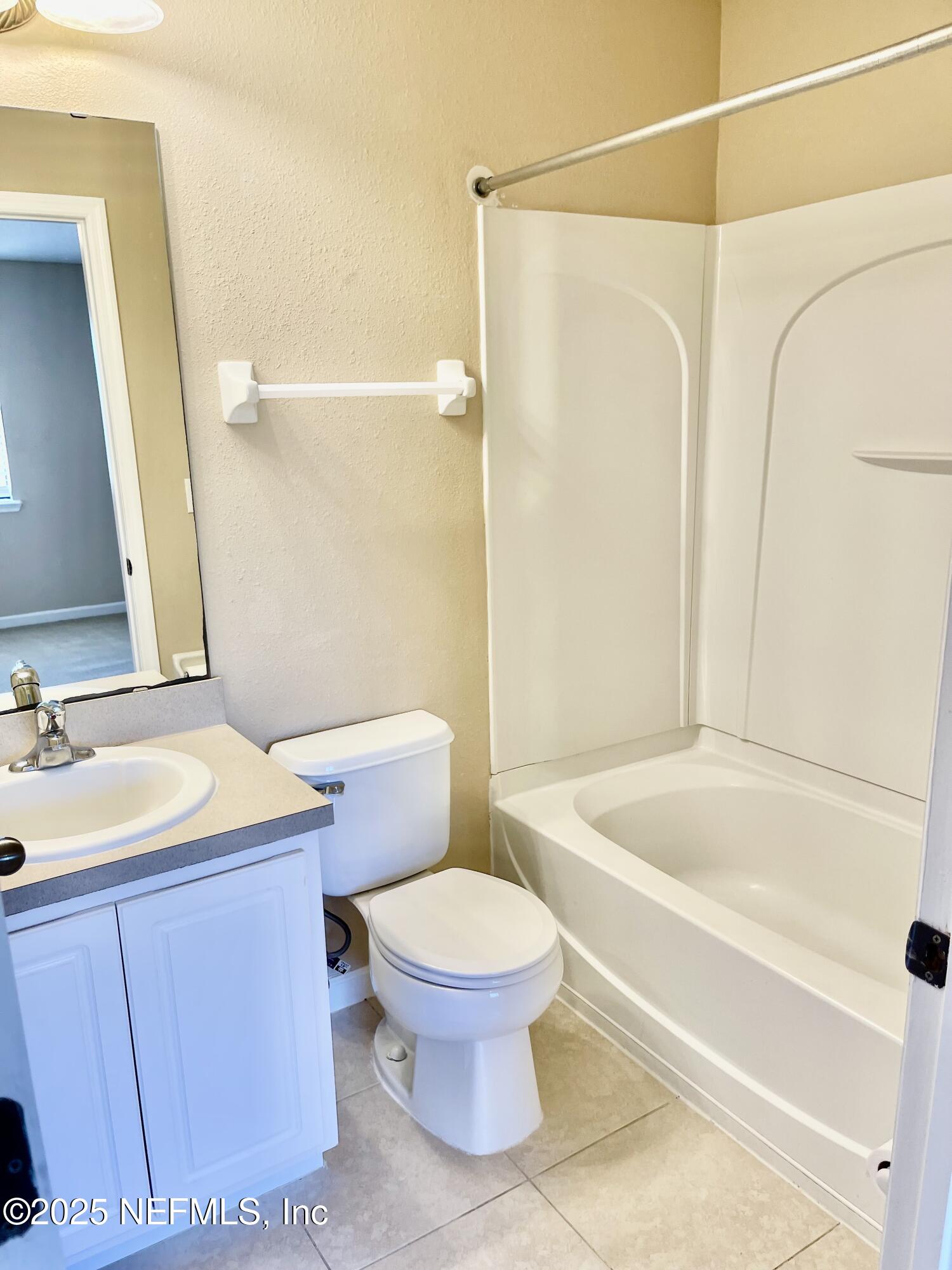 486 Cabernet Place St. Augustine, FL 32084 - Photo 11 of 29 a bathroom with a sink a toilet and a mirror