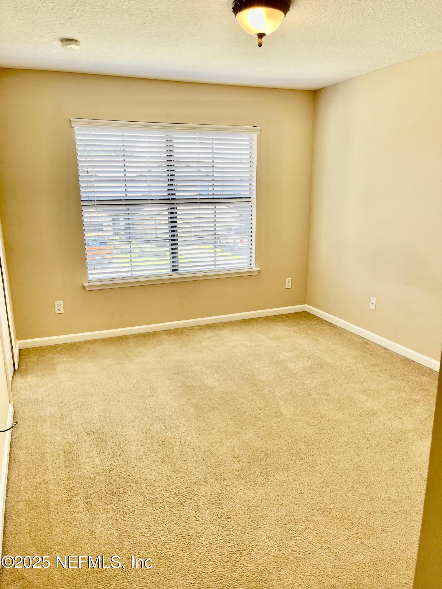 486 Cabernet Place St. Augustine, FL 32084 - Photo 12 of 29 a view of an empty room with a window