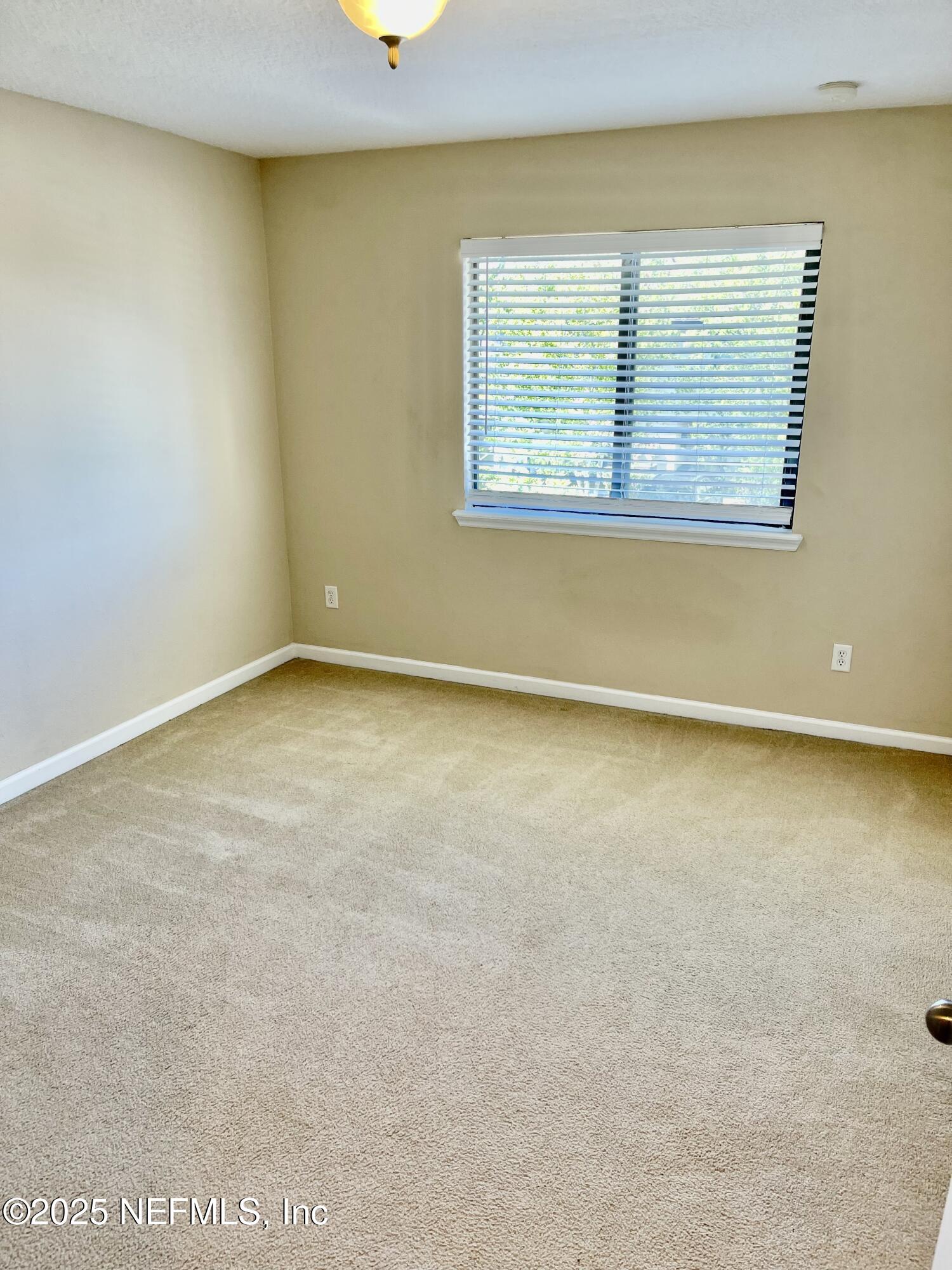 486 Cabernet Place St. Augustine, FL 32084 - Photo 13 of 29 an empty room with a window