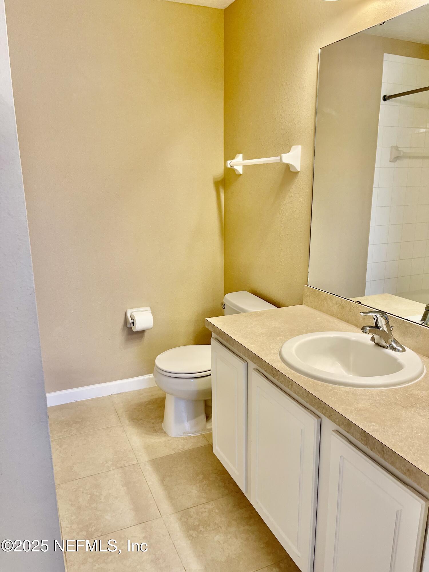 486 Cabernet Place St. Augustine, FL 32084 - Photo 14 of 29 a bathroom with a sink a toilet and a mirror