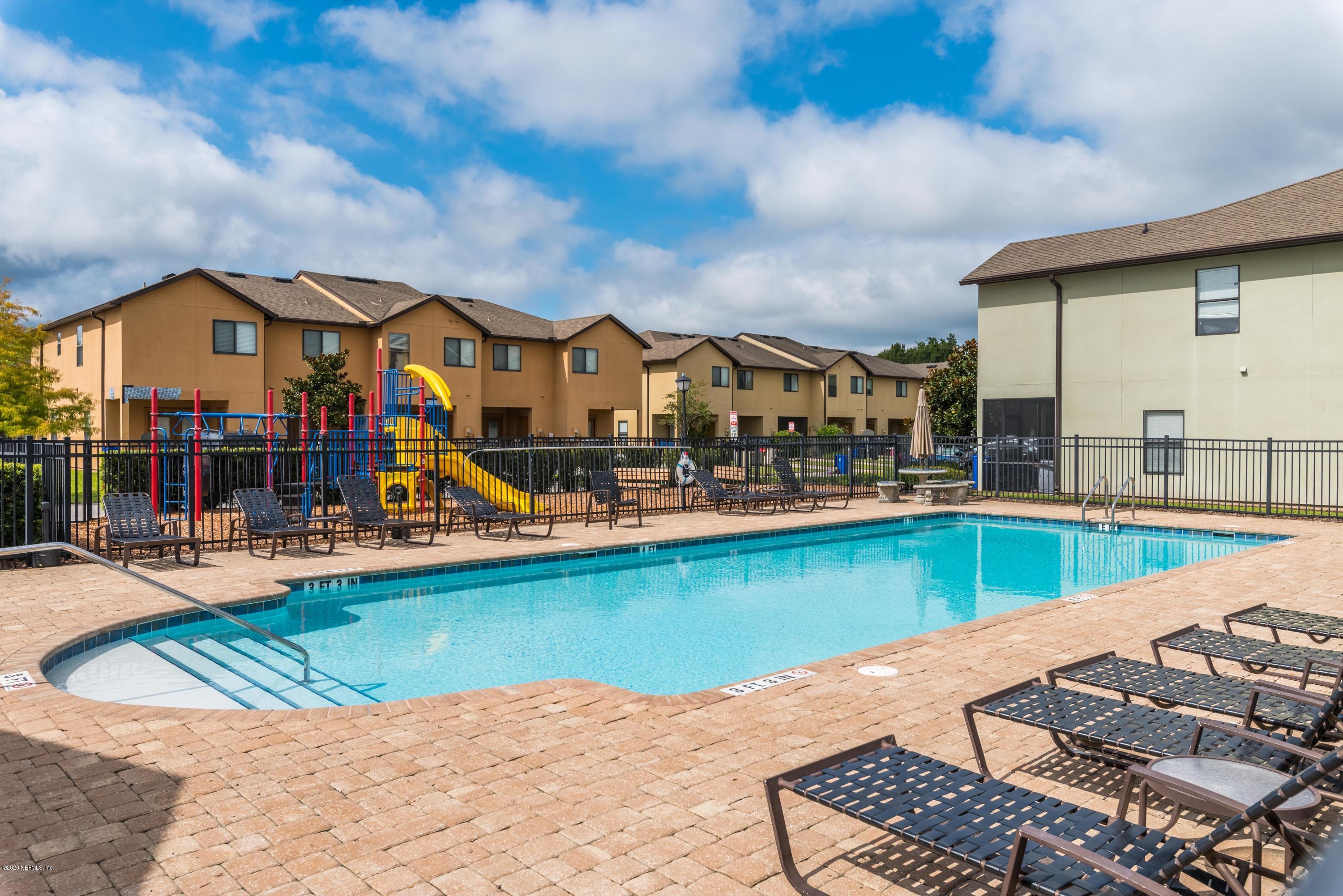 486 Cabernet Place St. Augustine, FL 32084 - Photo 21 of 29 a view of a swimming pool with a lounge chairs