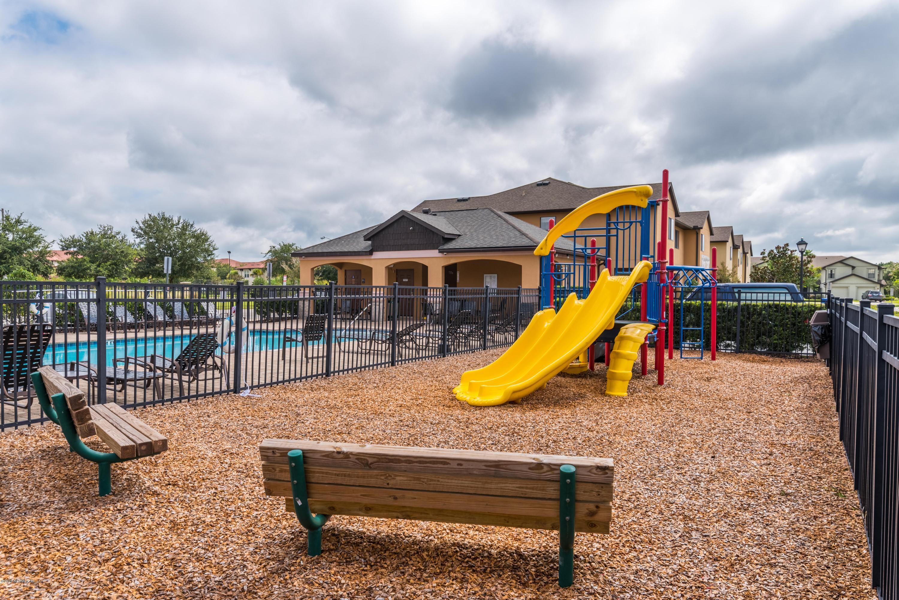 486 Cabernet Place St. Augustine, FL 32084 - Photo 23 of 29 a view of a swimming pool with a lounge chair