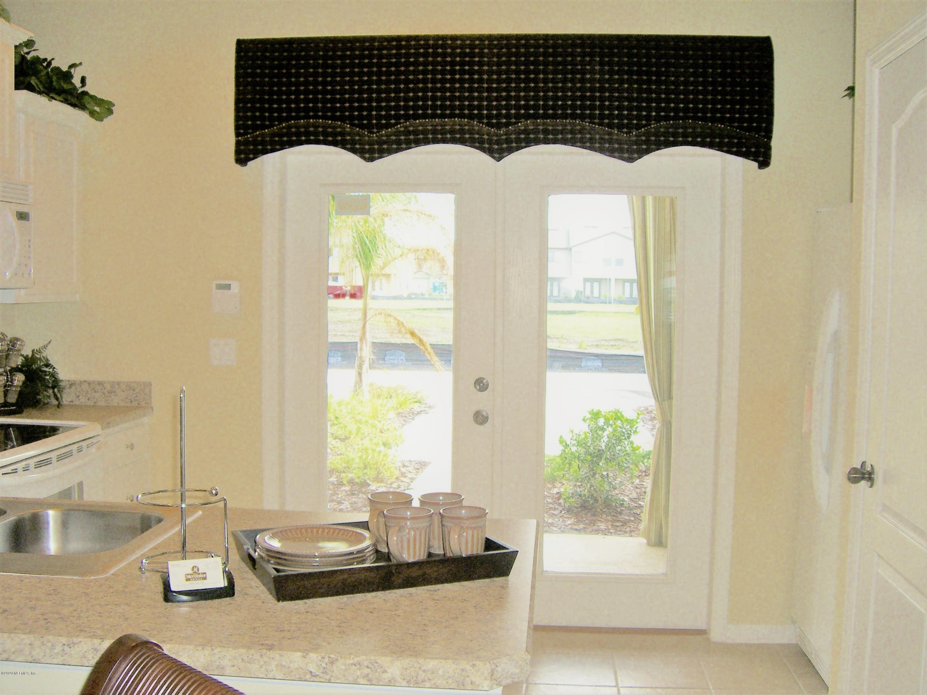 486 Cabernet Place St. Augustine, FL 32084 - Photo 28 of 29 a room with window and a potted plant