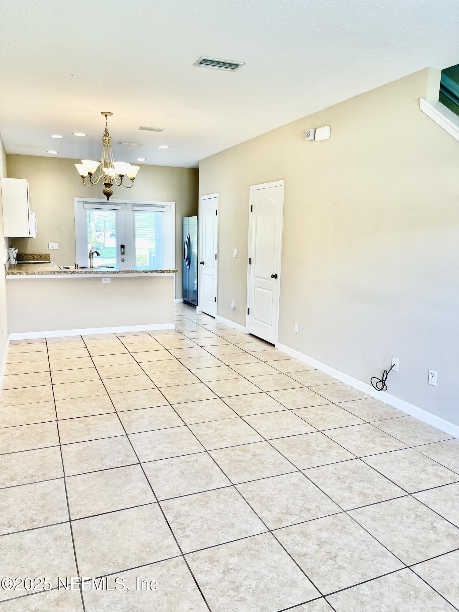 486 Cabernet Place St. Augustine, FL 32084 - Photo 9 of 29 a view of a living room with kitchen