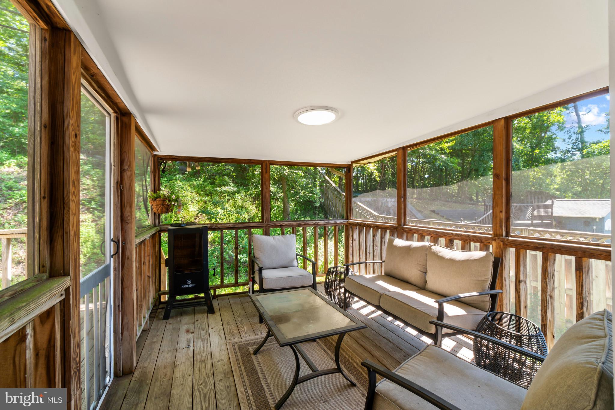 415 Baylor Road Glen Burnie, MD 21061 - Photo 20 of 29 a view of a porch with furniture and wooden floor