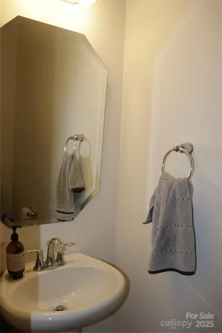 a bathroom with a sink and mirror