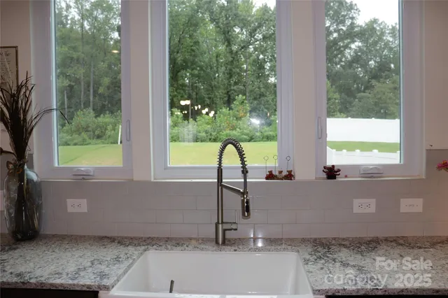 a view of a faucet chair and a potted plant