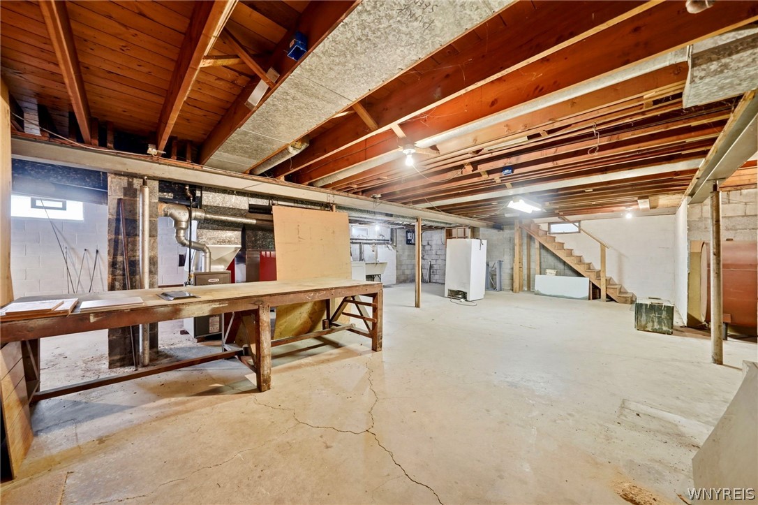 11168 Main Street Clarence, NY 14031 - Photo 33 of 50 Basement with worktables