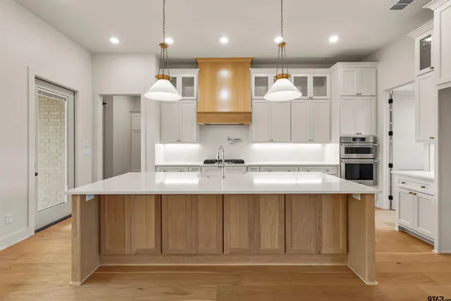 a view of kitchen with wooden floor