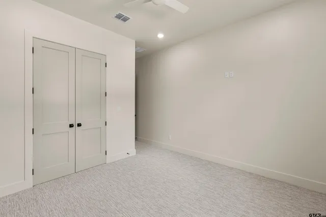 a bathroom with a sink and a mirror with bathtub