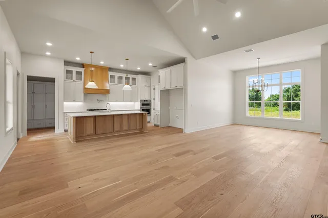 a view of kitchen with wooden floor and window