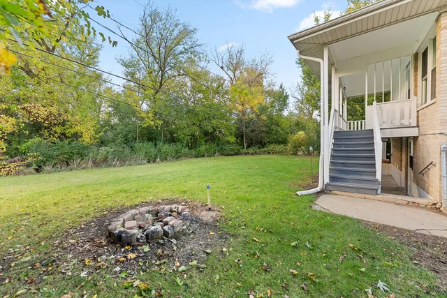 a view of a park with large trees
