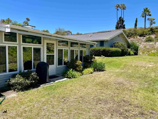 a view of a house with a garden