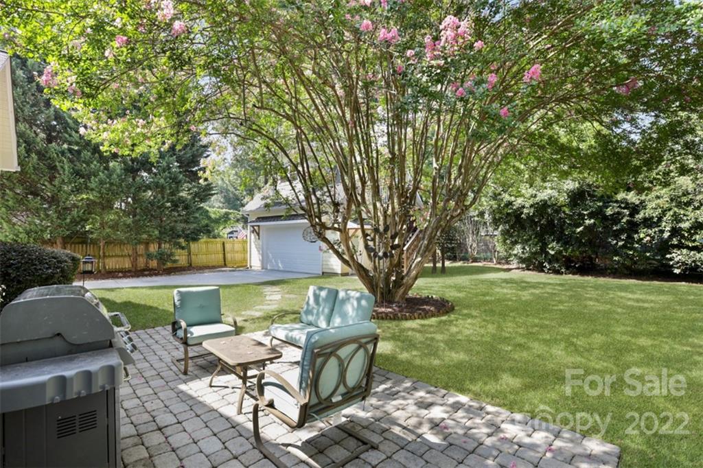 1023 Sedgefield Road Charlotte, NC 28209 - Photo 17 of 40 a view of a house with backyard sitting area and garden