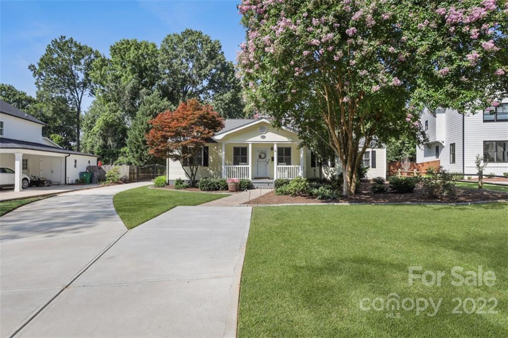 1023 Sedgefield Road Charlotte, NC 28209 - Photo 2 of 40 a front view of a house with a yard