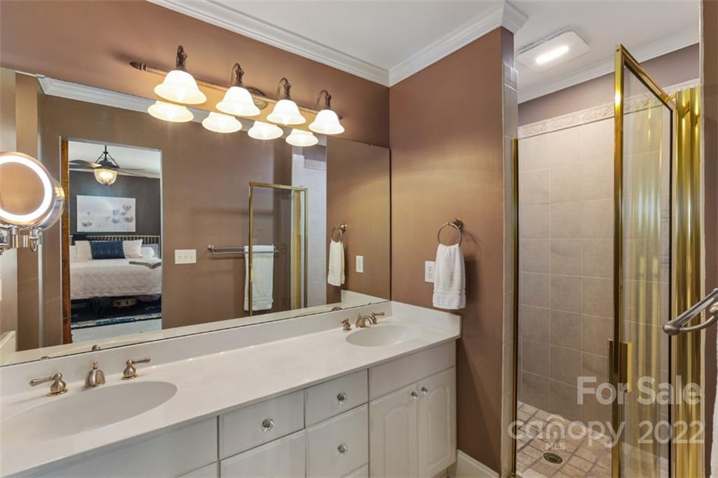 1023 Sedgefield Road Charlotte, NC 28209 - Photo 21 of 40 a bathroom with a double vanity sink and a mirror