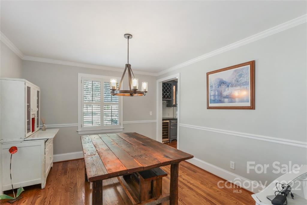 1023 Sedgefield Road Charlotte, NC 28209 - Photo 25 of 40 a view of a room with furniture window and wooden floor