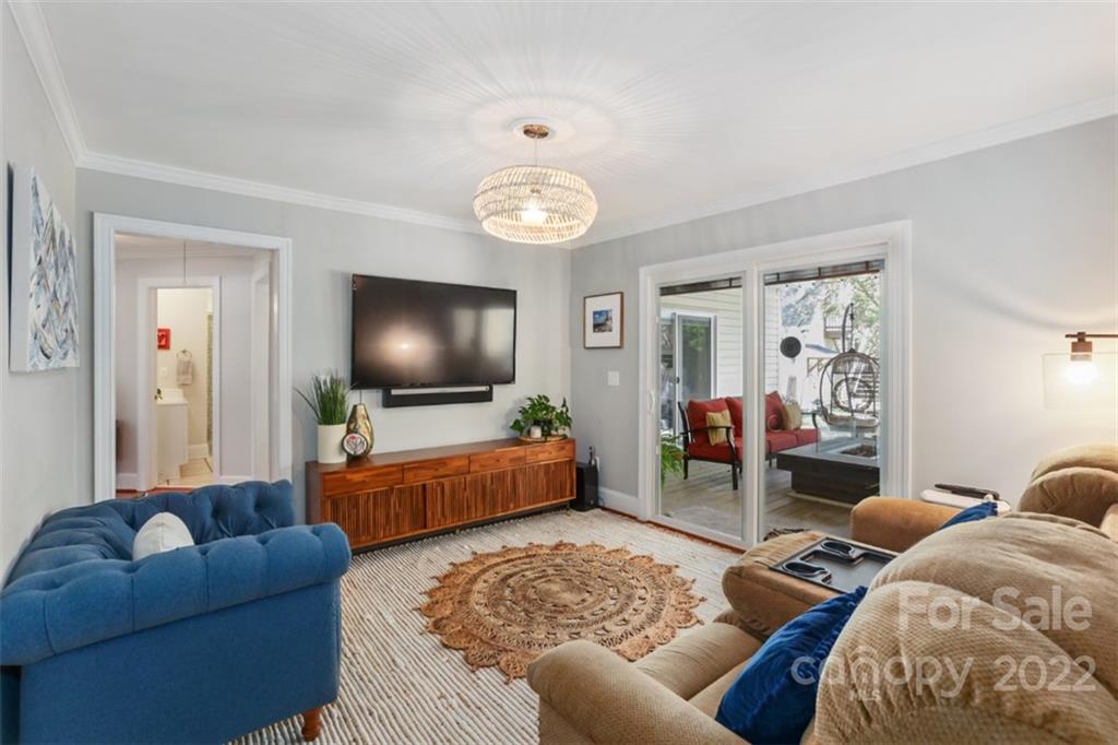 1023 Sedgefield Road Charlotte, NC 28209 - Photo 27 of 40 a living room with furniture and a flat screen tv