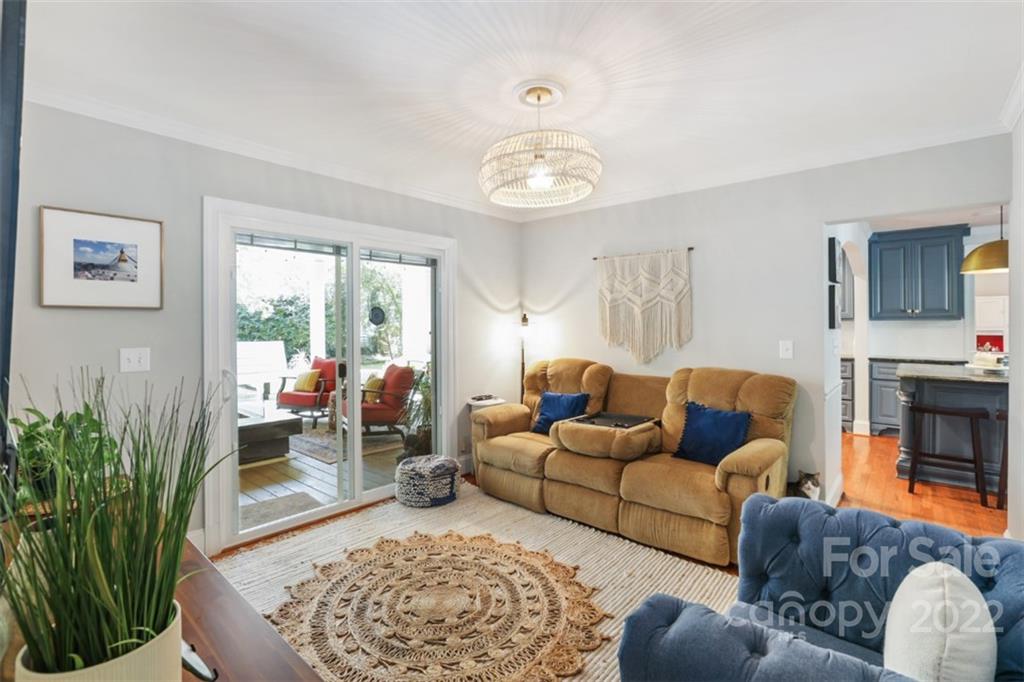 1023 Sedgefield Road Charlotte, NC 28209 - Photo 28 of 40 a living room with furniture potted plant and a window