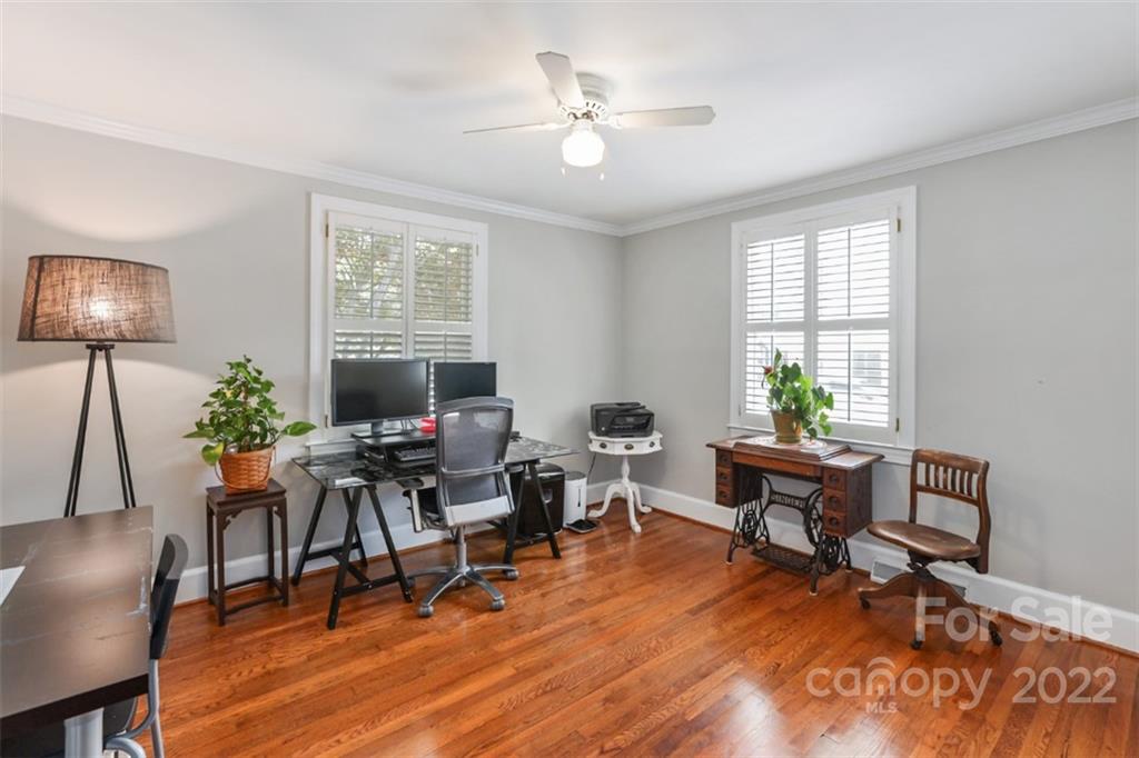 1023 Sedgefield Road Charlotte, NC 28209 - Photo 29 of 40 a living room with furniture and a wooden floor