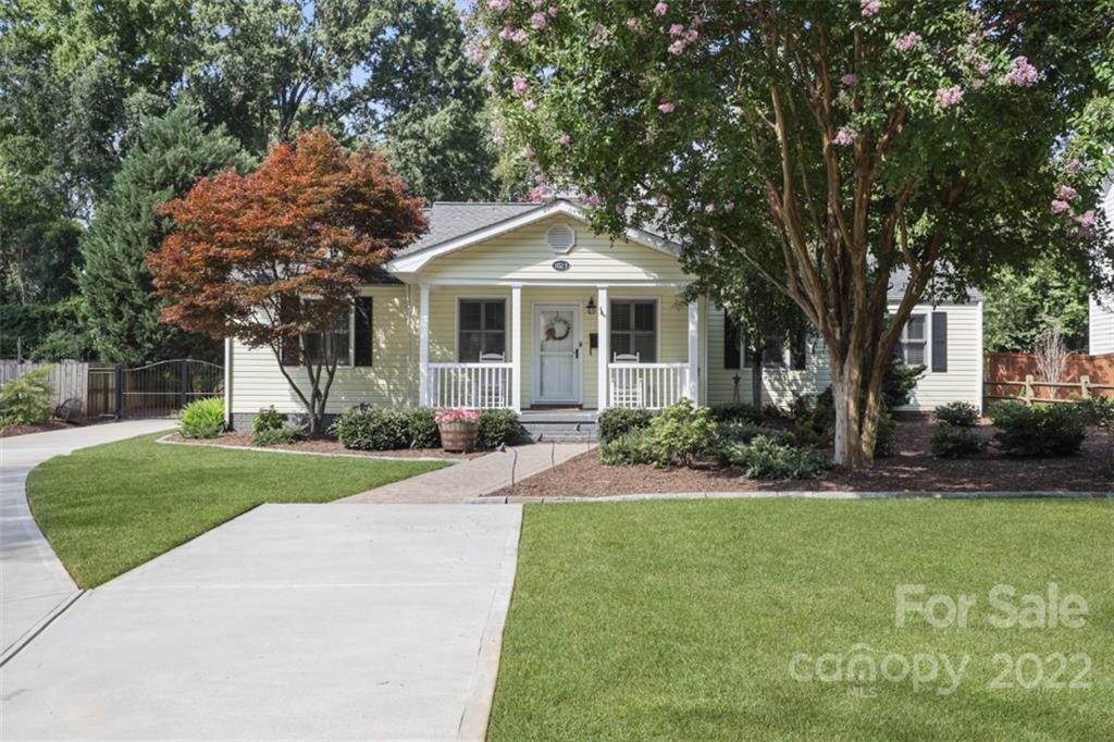 1023 Sedgefield Road Charlotte, NC 28209 - Photo 3 of 40 a front view of a house with a yard and porch