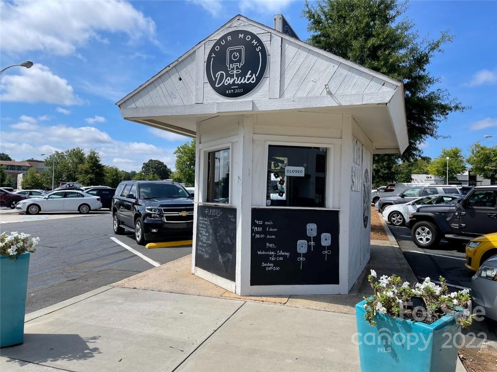 1023 Sedgefield Road Charlotte, NC 28209 - Photo 33 of 40 a view of a building with cars parked