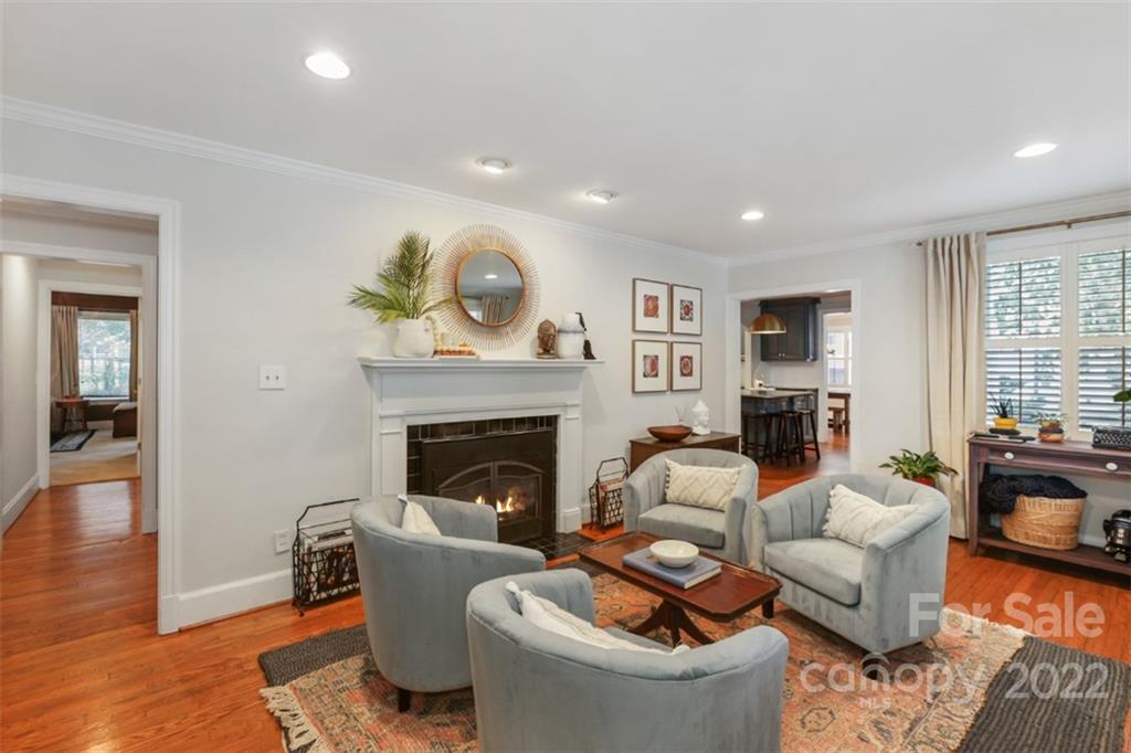1023 Sedgefield Road Charlotte, NC 28209 - Photo 8 of 40 a living room with furniture and a fireplace