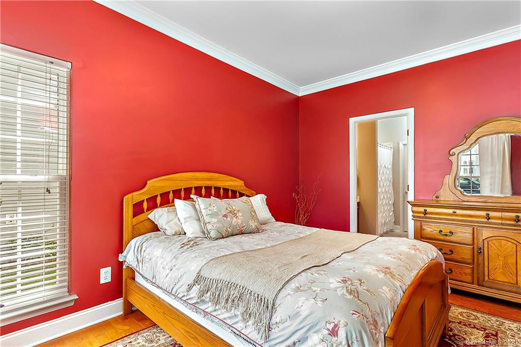 13011 Meadowmere Road Huntersville, NC 28078 - Photo 11 of 20 a bedroom with bed and wooden floor