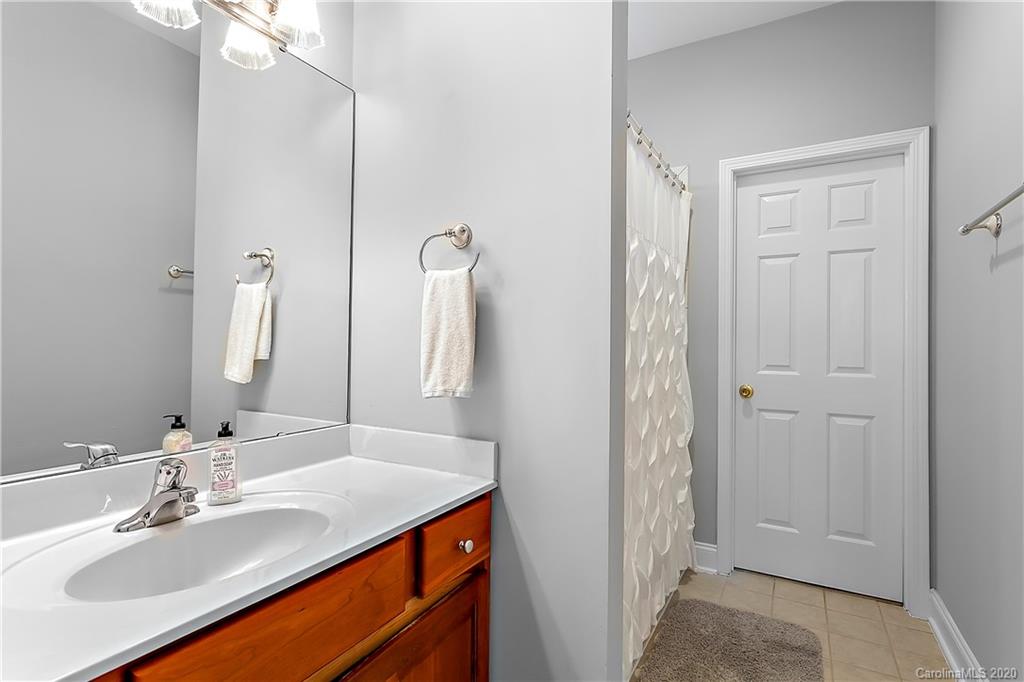 13011 Meadowmere Road Huntersville, NC 28078 - Photo 13 of 20 a bathroom with a sink vanity granite and a mirror