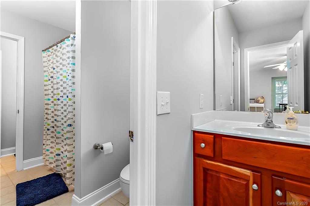 13011 Meadowmere Road Huntersville, NC 28078 - Photo 18 of 20 a bathroom with a sink a toilet and shower