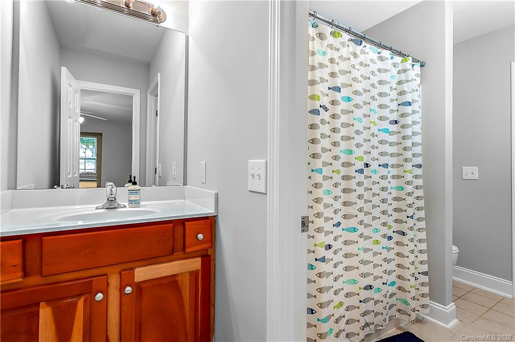 13011 Meadowmere Road Huntersville, NC 28078 - Photo 19 of 20 a bathroom with a sink and a mirror