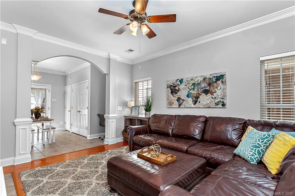 13011 Meadowmere Road Huntersville, NC 28078 - Photo 4 of 20 a living room with furniture and wooden floor