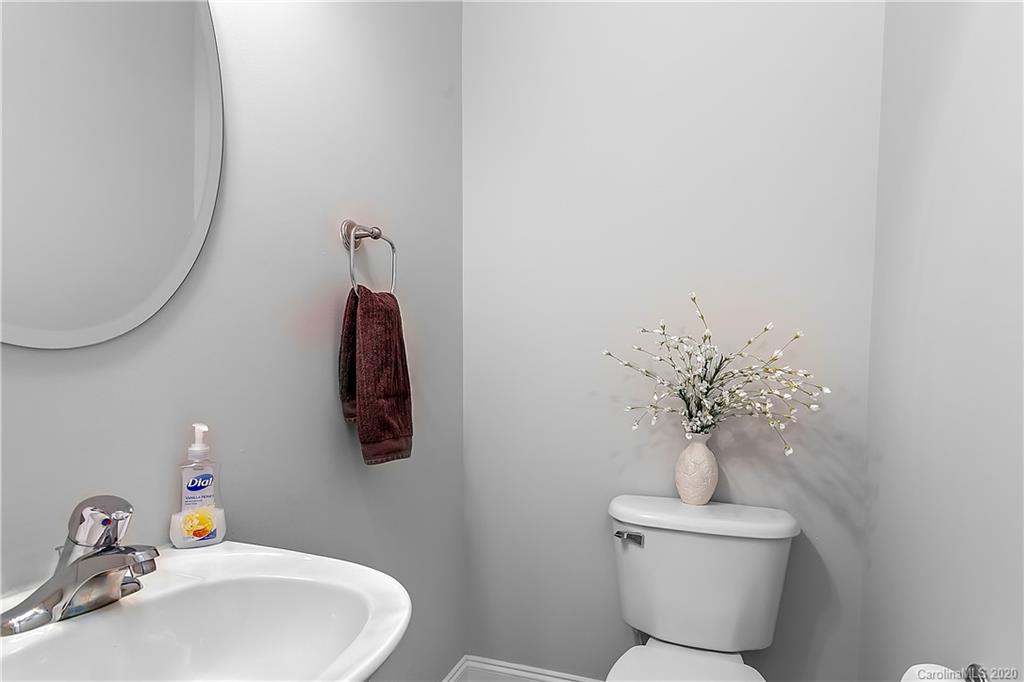 13011 Meadowmere Road Huntersville, NC 28078 - Photo 10 of 20 a bathroom with a toilet sink and mirror