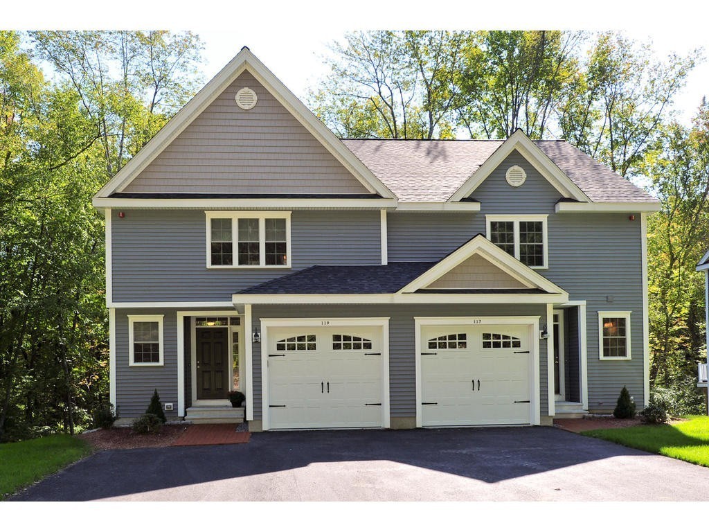 117 Dudley Road, Unit 117 Berlin, MA 01503 - Photo 1 of 21 a front view of a house with a yard