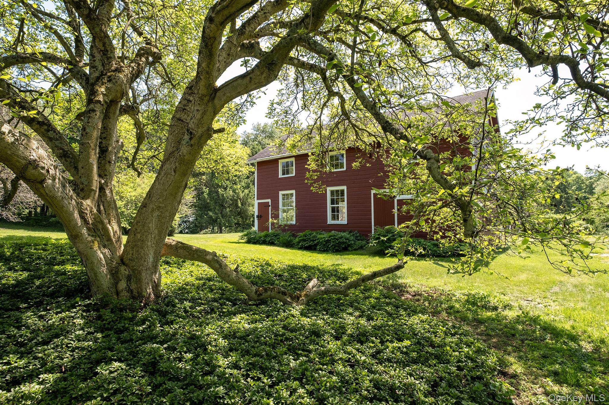 77 Upper Hook Road Rhinebeck, NY 12572 - Photo 36 of 48 a view of a house with yard and large trees