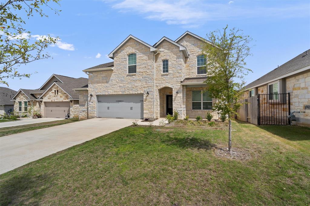 236 Prato Place Georgetown, TX 78628 - Photo 4 of 40 A classic stone facade with arched entryways defines this welcoming family dwelling.