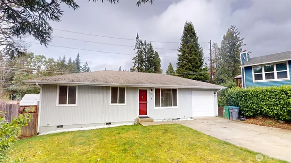 a front view of a house with yard
