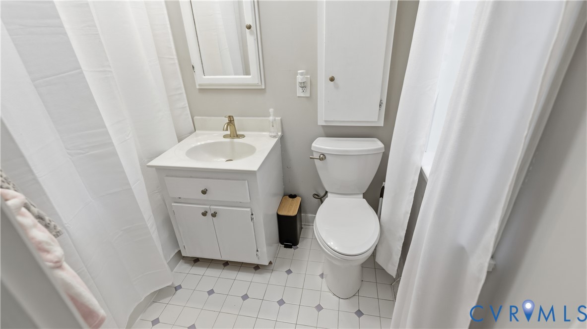 11430 Marsden Road Chester, VA 23831 - Photo 16 of 33 Bathroom featuring a white vanity with integrated